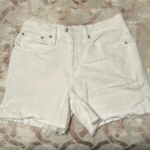 White J crew short, distressed at the legs